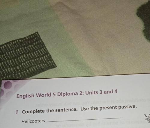 1Complete the sentences. Use the present passive.Helicopters​